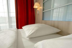 Krevet ili kreveti u jedinici u okviru objekta Park Inn by Radisson Linz