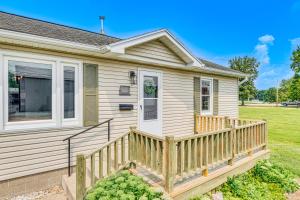 a home with a wooden porch and a fence at Peaceful Robinson Home with Yard, Near Golf Courses! in Robinson