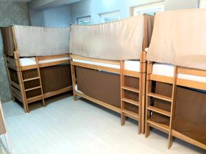 a group of bunk beds in a room at Historia Hostel in Skopje