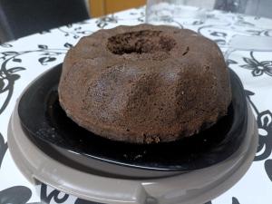 a chocolate cake sitting on a plate on a table at Historia Hostel in Skopje