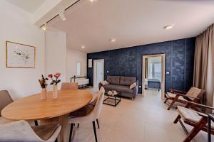 a living room with a table and a couch at Apartments by the sea Prizba, Korcula - 22068 in Blato