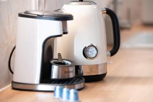 a coffee maker sitting on top of a counter at La Casona de Obdulia II in Tresgrandas