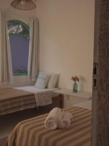 Postel nebo postele na pokoji v ubytování Vila Rita Hostel Arraial d'Ajuda