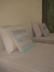 Postel nebo postele na pokoji v ubytování Vila Rita Hostel Arraial d'Ajuda