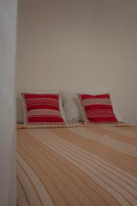 Postel nebo postele na pokoji v ubytování Vila Rita Hostel Arraial d'Ajuda