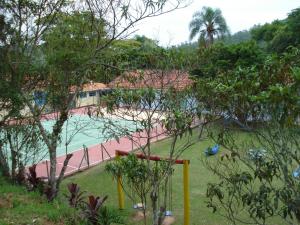 a view of a resort with a swimming pool at Pousada Sapucaia in Guararema