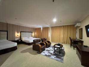 Postel nebo postele na pokoji v ubytování Remington Hotel