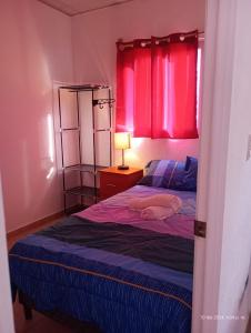 En eller flere senge i et værelse på Casita bonita Ecoterra