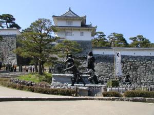 a statue of people in front of a building at Urban Hotel Nihonmatsu - Vacation STAY 78342v in Nihommatsu