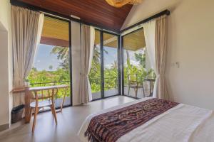 Postelja oz. postelje v sobi nastanitve Abian Ubud View