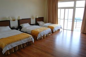 Voodi või voodid majutusasutuse 海天酒店 toas