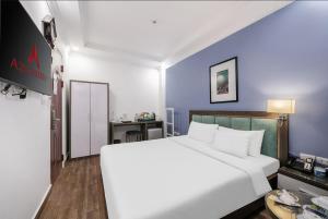 Postel nebo postele na pokoji v ubytování A25 Hotel - 109 Trúc Bạch