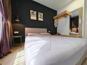 a bedroom with a large white bed and a mirror at Mykey The Wave B-21-15 Melaka City in Melaka