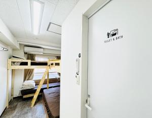Palanda nebo palandy na pokoji v ubytování GUEST HOUSE B's FiveⅡ
