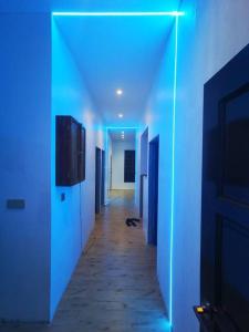 a hallway with blue lights in a room at Homestay Senggarang in Senggarang