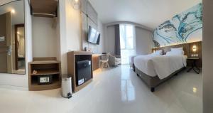 Postel nebo postele na pokoji v ubytování Front One Resort Indraloka Temanggung