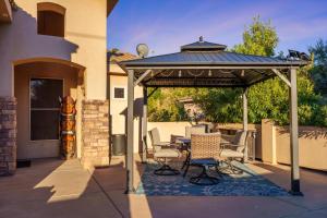 a gazebo with chairs and a table on a patio at New Mgt 204 Verified 5 Star Reviews Brilliant Home in La Verkin