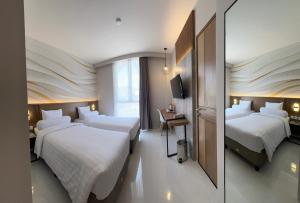 Postel nebo postele na pokoji v ubytování Front One Resort Indraloka Temanggung