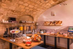a kitchen with a bunch of food on a counter at Hôtel Volney Opéra in Paris