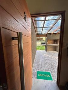 a door with a sign that at Cabañas La Arbolada in El Durazno