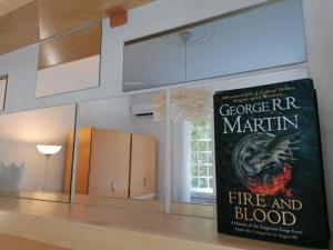 a book sitting on a counter next to a window at RiverRetreat in Belgrade