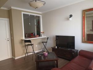 a living room with a couch and a flat screen tv at open in Potenza