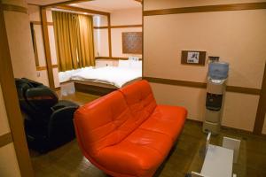 Postel nebo postele na pokoji v ubytování Hotel HERB ホテルハーブ大人用