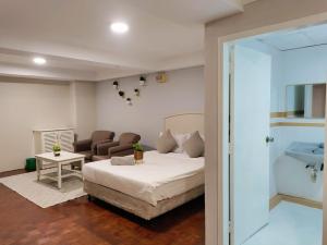 Postel nebo postele na pokoji v ubytování The Little Star Studio Hotel- Star Regency