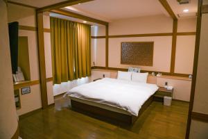 Postel nebo postele na pokoji v ubytování Hotel HERB ホテルハーブ大人用 + 22 fotografií