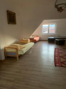 a bedroom with a bed in a room with a staircase at Anastasia&ale pension in Mediaş