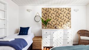 Postel nebo postele na pokoji v ubytování Beach Bungalow