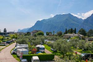a parking lot with mountains in the background at Casa al Cor Apartments in Nago-Torbole