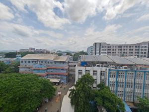 an overhead view of a city with buildings and trees at The Klift in Vellore