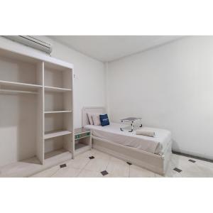 Letto o letti in una camera di Urbanview Hotel Utari