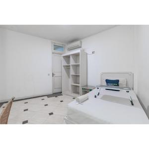 Letto o letti in una camera di Urbanview Hotel Utari