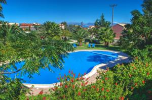 an image of a swimming pool in a resort at Jasmine Apartments in Sidari