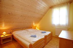 Postel nebo postele na pokoji v ubytování Valašský Šalet + 37 fotografií