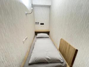Postel nebo postele na pokoji v ubytování WORK INN TPE
