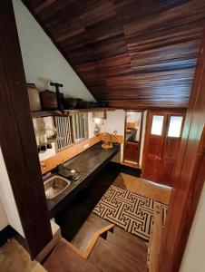 an overhead view of a kitchen with a sink at Svarna in Udupi +37 photos