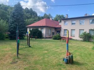 a group of baseball equipment in the yard of a house at Family Paradise Huslenky in Huslenky