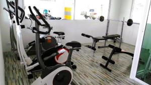a room with a gym with two exercise bikes at Beach condo Jomtien 12 SuperHost in Jomtien Beach