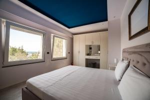 Postel nebo postele na pokoji v ubytování Epirus Hotel