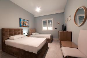 Postel nebo postele na pokoji v ubytování Epirus Hotel
