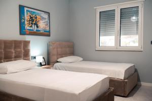 Postel nebo postele na pokoji v ubytování Epirus Hotel