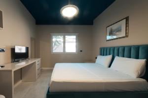 Postel nebo postele na pokoji v ubytování Epirus Hotel