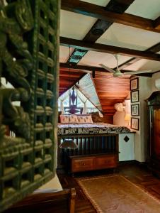 a room with a bed and a window at Svarna Heritage in Kalyānpur
