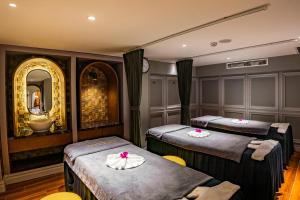 Voodi või voodid majutusasutuse Minerva Premium Hotel toas