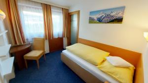 Łóżko lub łóżka w pokoju w obiekcie Zeitlos Apartments - Gerlos