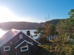 a house with a view of a lake at Flott feriehus Søgne in Kristiansand