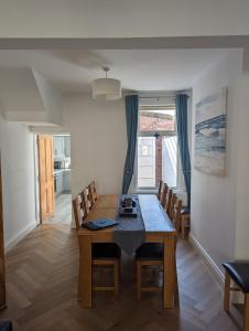 a dining room with a table and chairs at Prospect House in Bangor